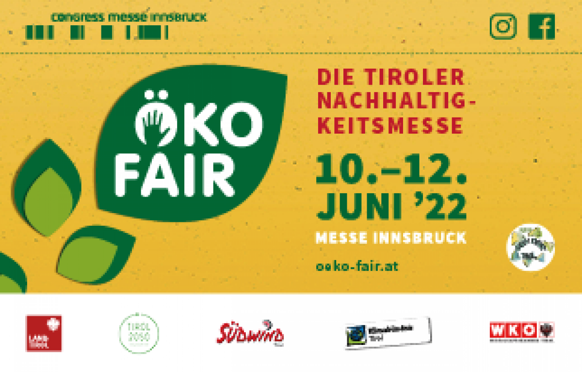 Das Banner der Öko-Fair hat einen senfgelben Hintergrund, darauf grüne stilisierte Blättern. Text: Öko Fair. Die Tiroler Nachhaltigkeitsmesse, 10.-12. Juni '22, Messe Innsbruck